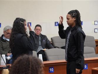 A close up of a Mock Trial matchups poster