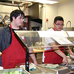 Students serving lunch at Strawberry Corner cafeteria